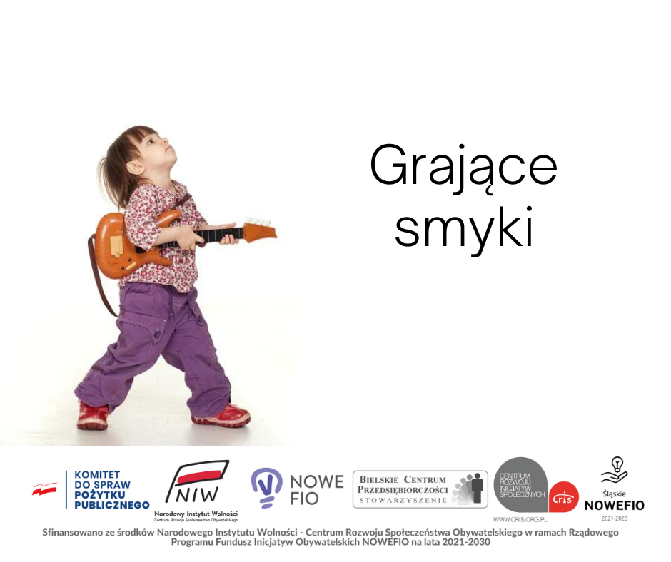 dziecko trzymające w rękach skrzypce